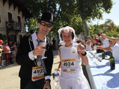 A Couple Drinking Red Wine At The Marathon Du Medoc